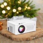 PURSHE Mini Bluetooth Projector Full HD 1080P Portable Outdoor Movie Projector for iOS Android Windows Compatible with TV Stick HDMI Smartphone PS4 USB Remote Included Christmas Tree Shape